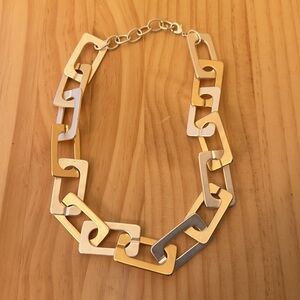 Statement chunky two tone metal necklace.
